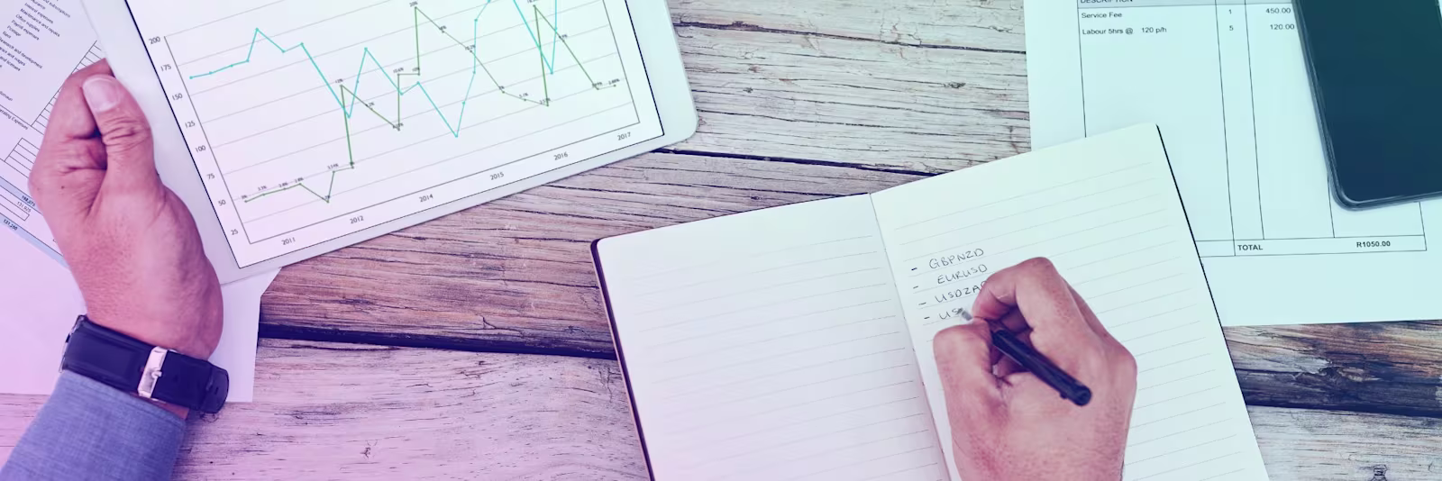 exchange-rates-header An image of someone writing