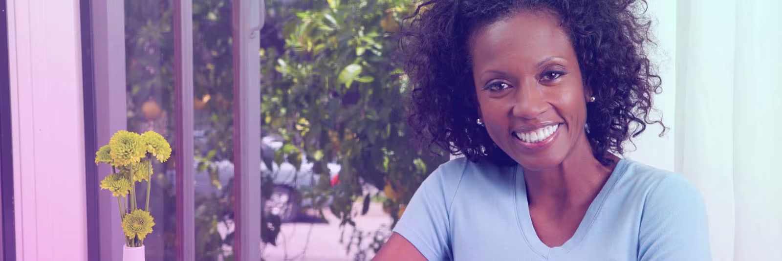 migrants-day-header An image of a lady smiling