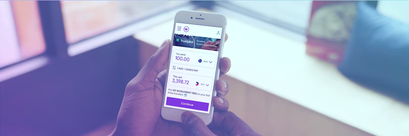 An image of someone using WorldRemit on their phone