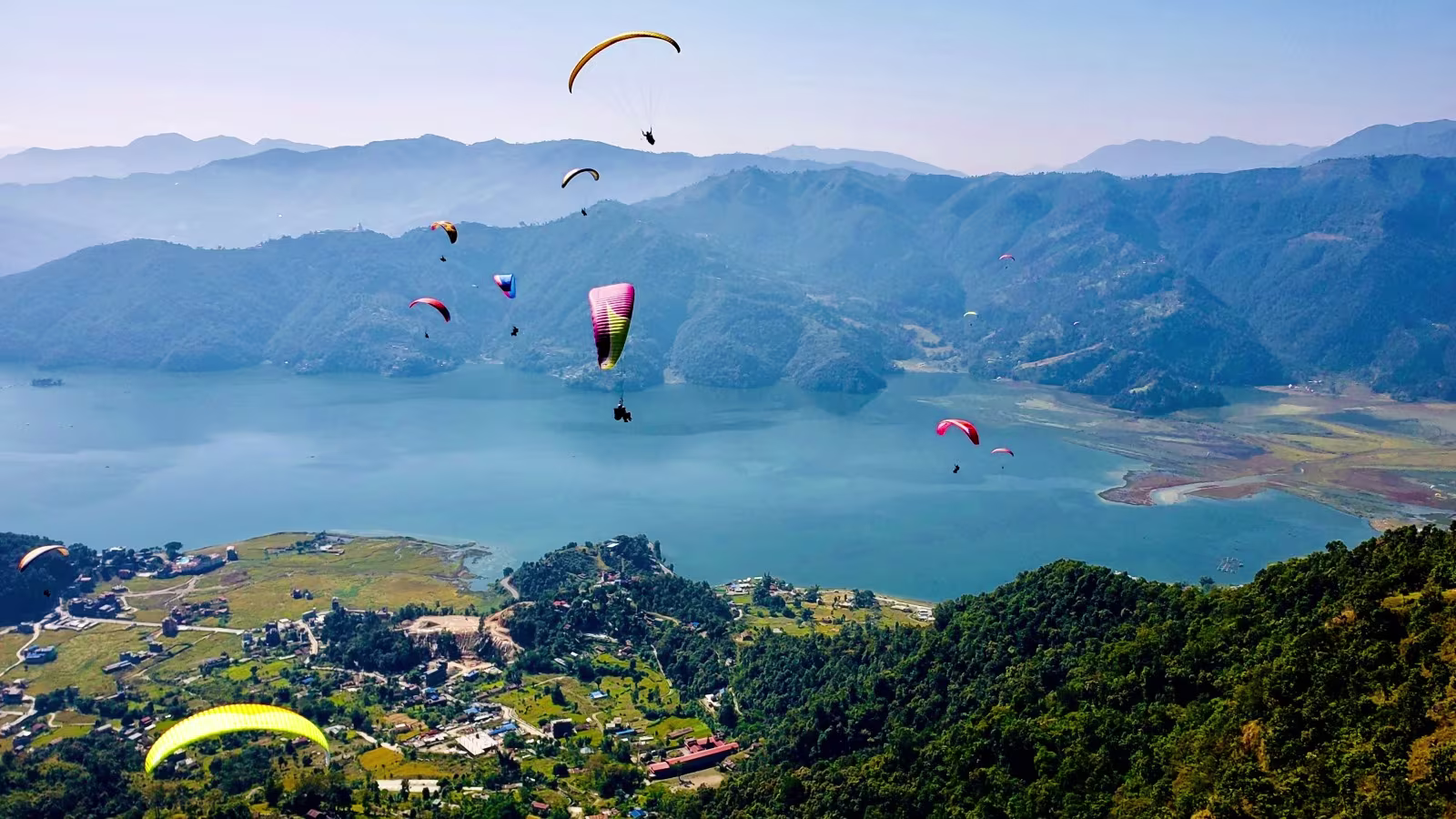 paragliders over the Phewa Lake in Nepal