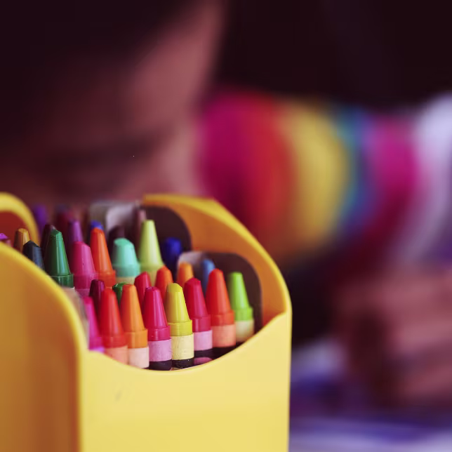 Back to school allowances in the UK Box of crayons in bokeh effect