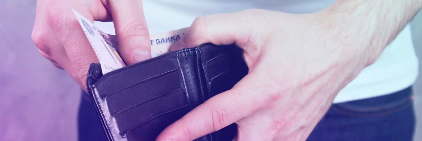 header-cash-pick-up-collection An image of someone taking money out of a wallet