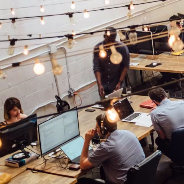 A group of migrants working in the office