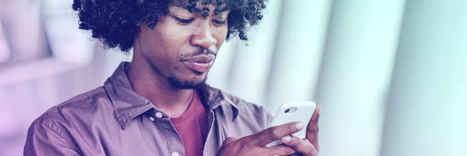 An image of a man using his phone