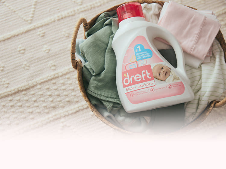A basket with the newborn clothes washed with Dreft