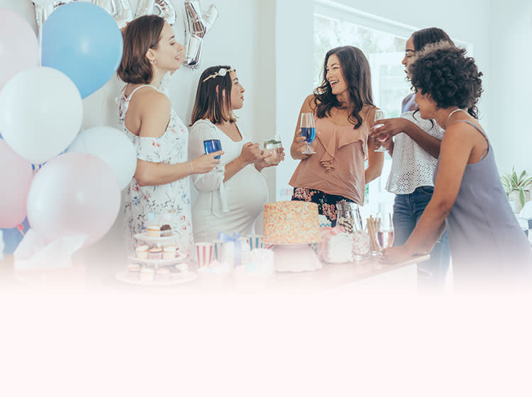 5 people talking at a baby shower