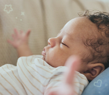 Sleepy child clapping his hands