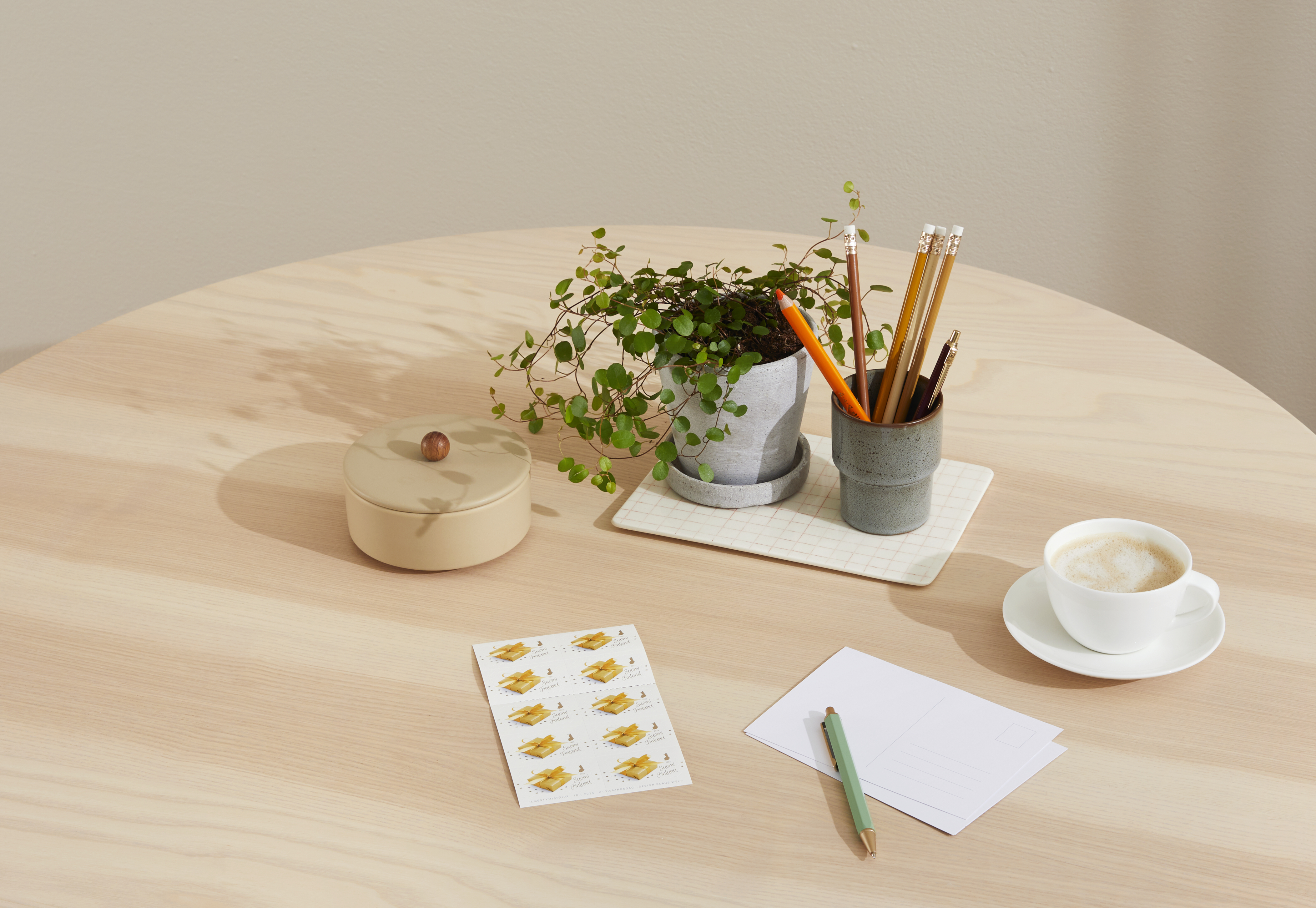 Stamps and envelopes on a table.