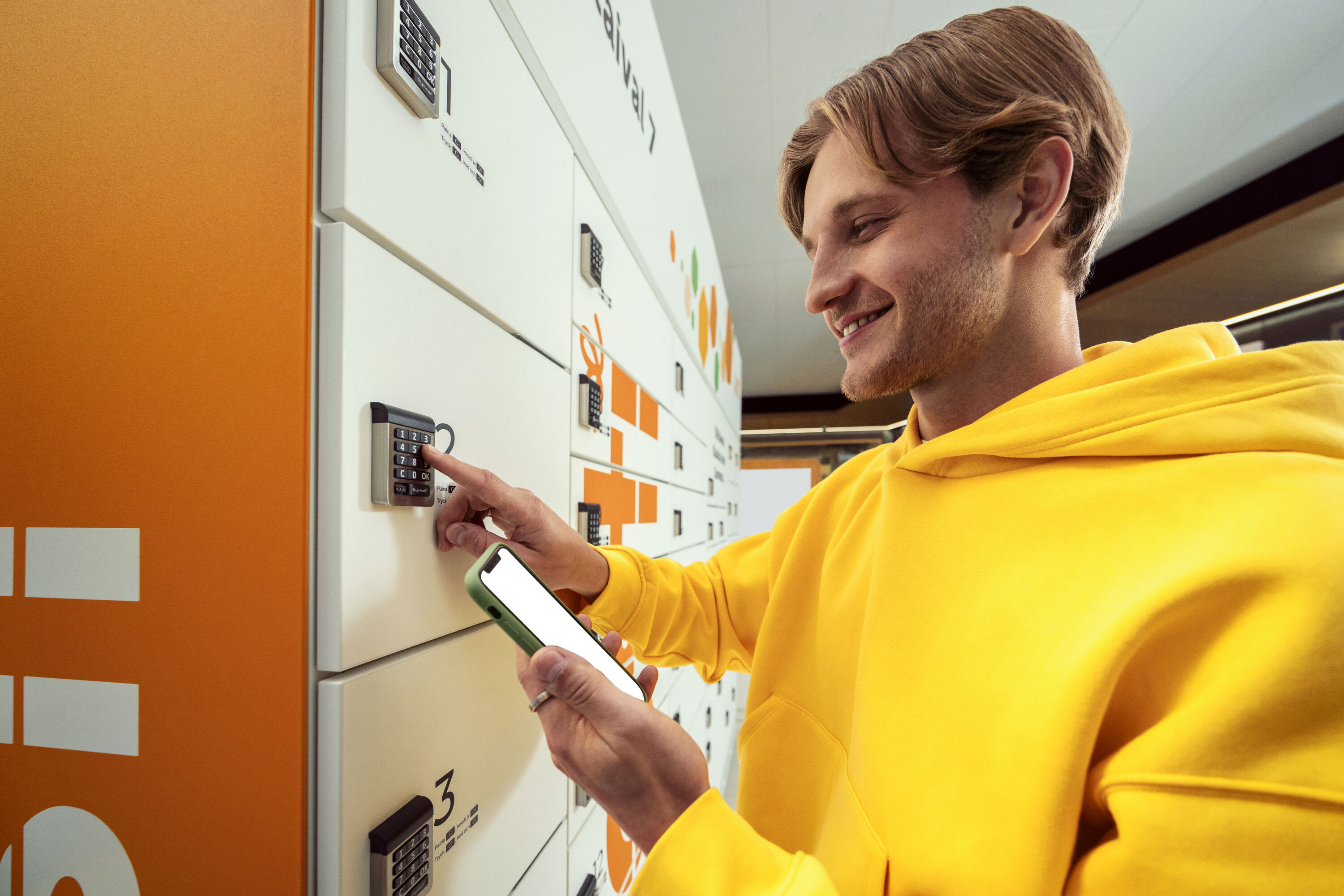 A man at the Posti Parcel Locker.