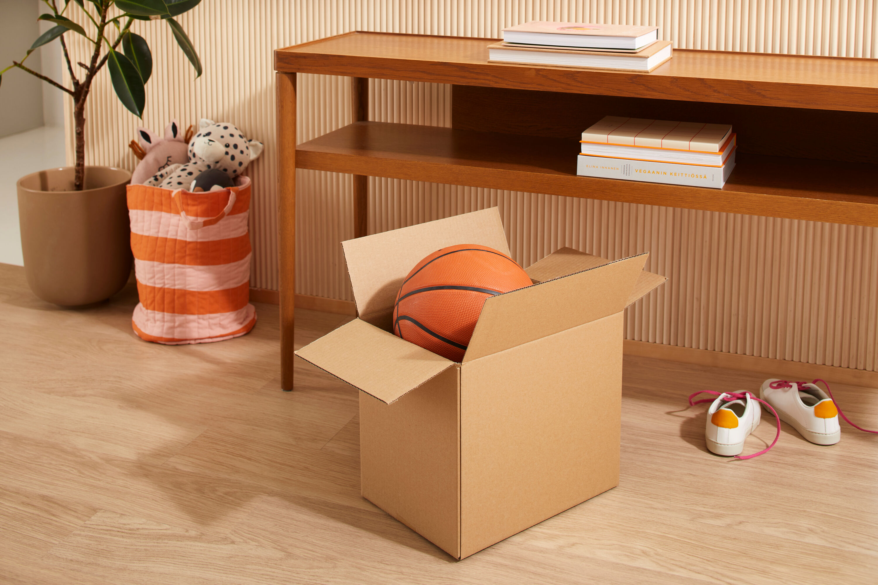 Cardboard box with a basketball.