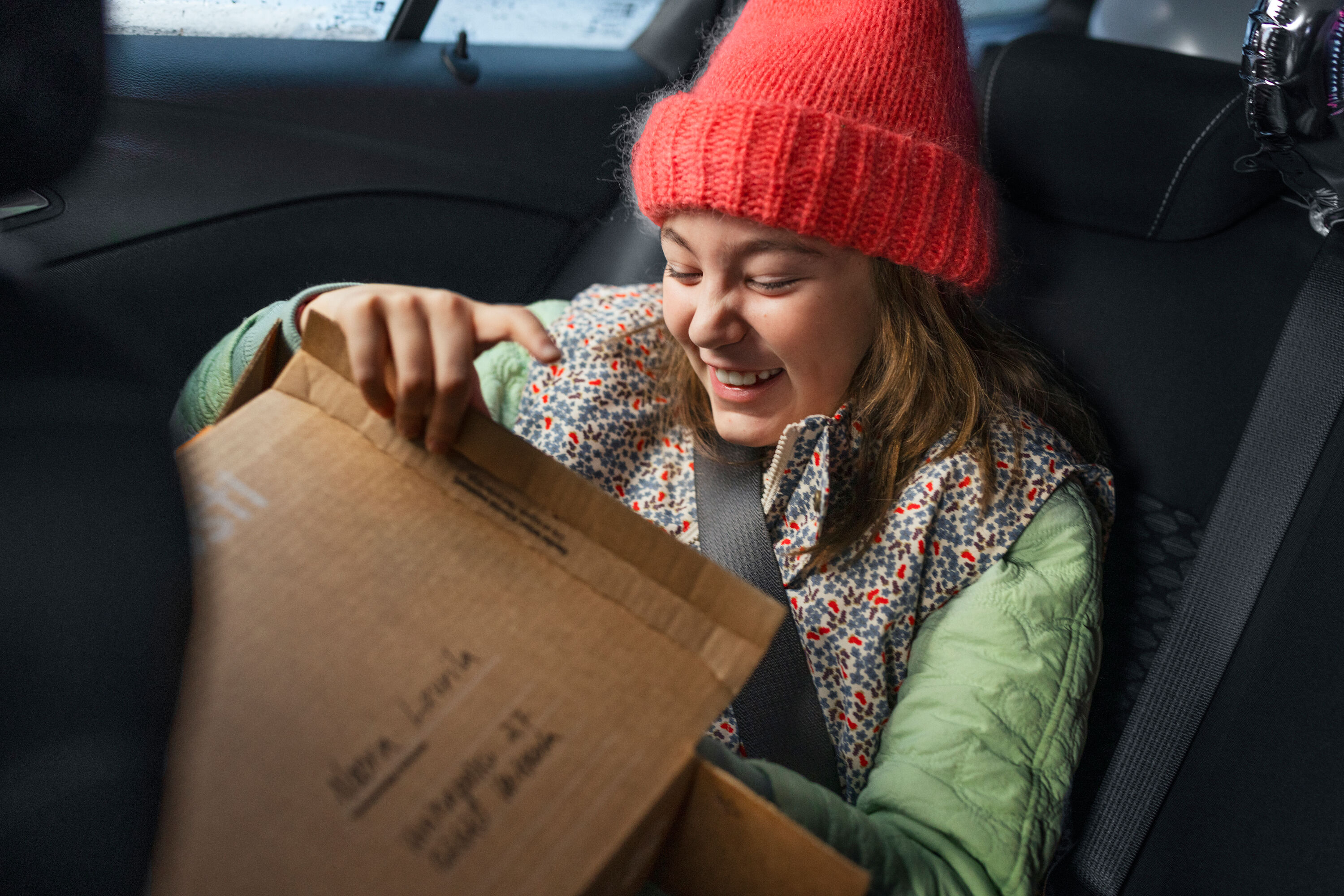 The woman opens the package