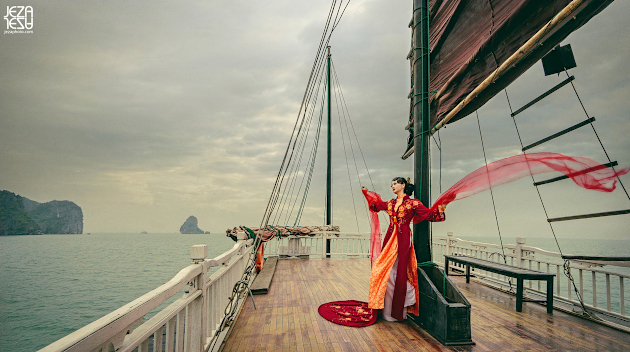 Bride in Vietnamese Áo dài on junk boat in Ha Long Bay, Vietnam