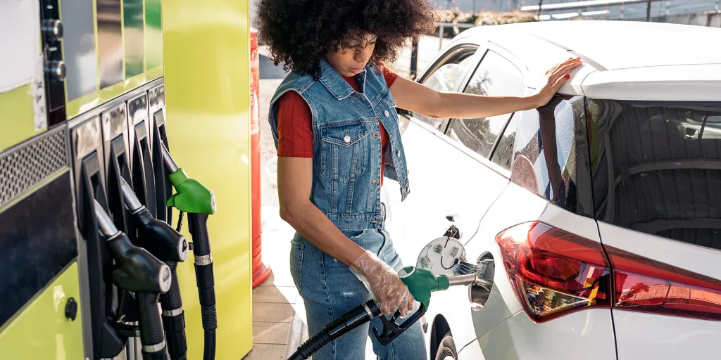Woman pumping gas
