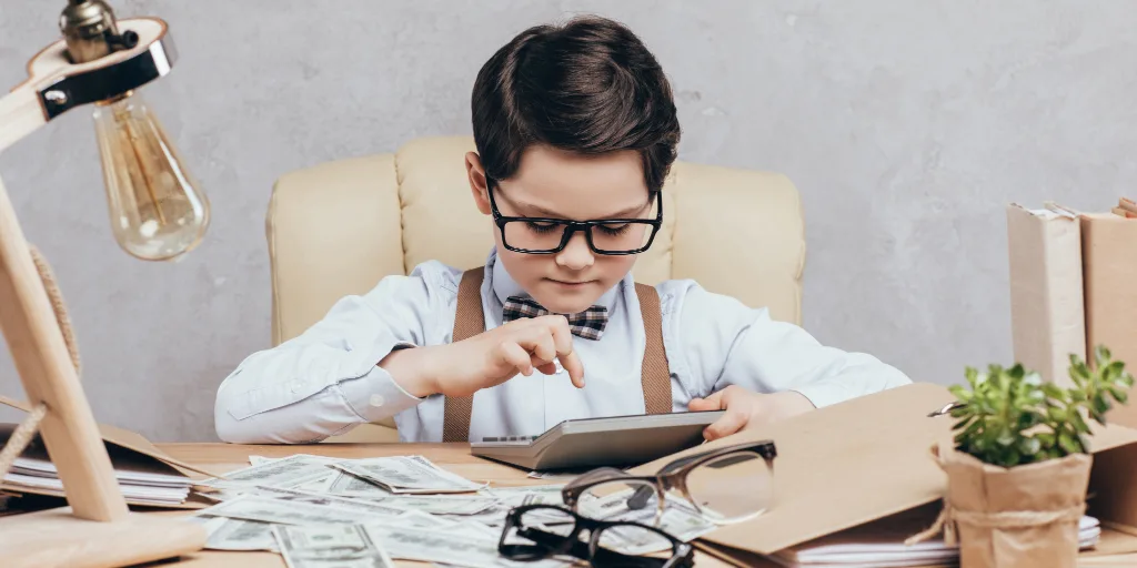 Nerdy kid with calculator