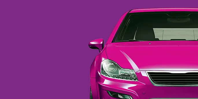Bright pink car front view against purple background showing headlight and grille detail