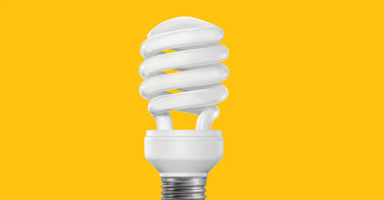 White spiral compact fluorescent light bulb on bright yellow background, energy-efficient lighting concept.