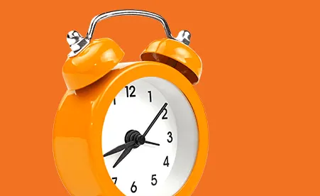 Alarm Clock on orange background