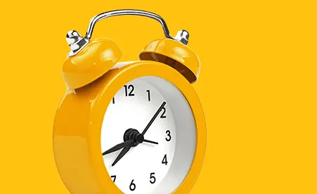 Alarm Clock on yellow background