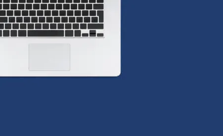Laptop corner on blue background
