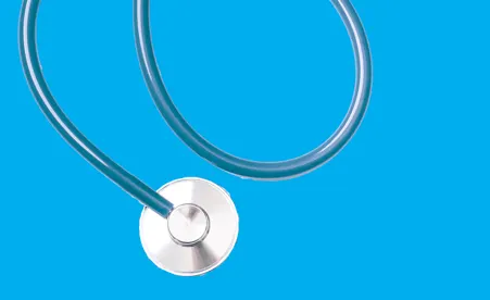Stethoscope on blue background