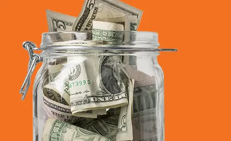 Jar of Cash on orange background