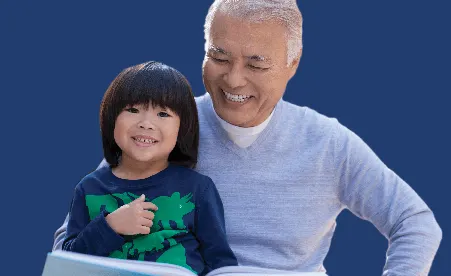 Dad & Son smiling for picture on navy background