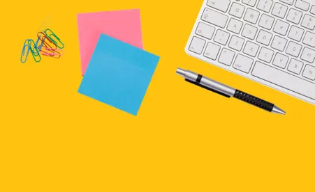 Office supplies on yellow background