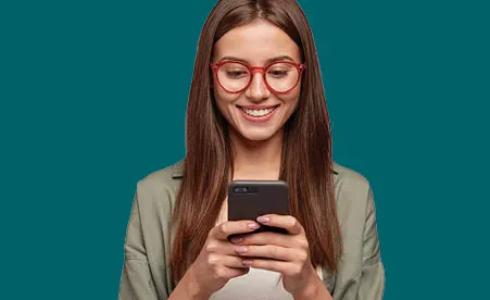 Women smiling on phone on dark green background