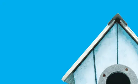 Birdhouse on blue background