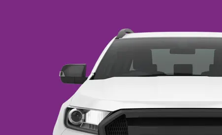 White commercial van front view against purple background showing headlight and windshield details