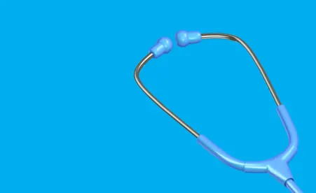 Stethoscope on blue background