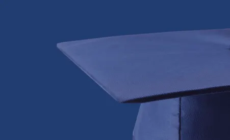 Graduation cap on navy background