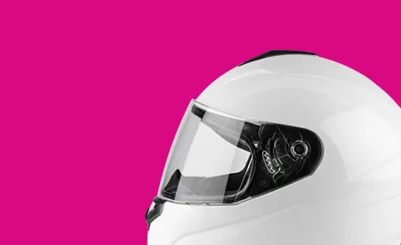 Motorcycle helmet on pink background