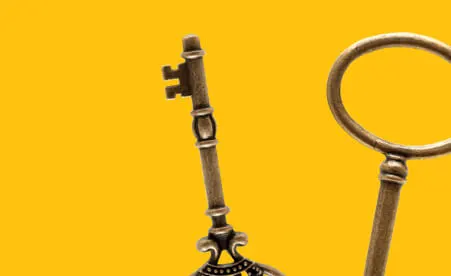 Old keys on yellow background