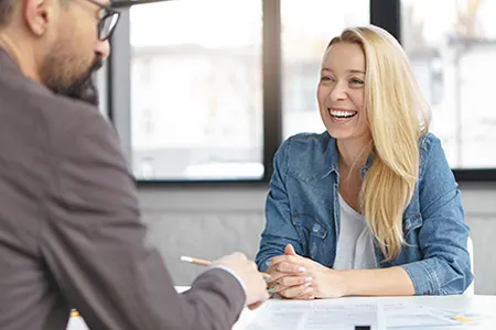 Lady sitting across the table from an agent