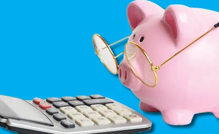 Piggy bank with glasses and calculator on blue background