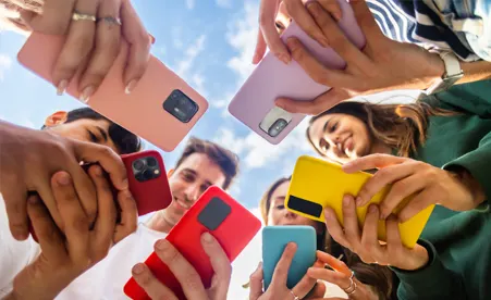 Group of people using their phones