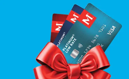Three Metro Bank credit cards in red and teal colors tied with a red ribbon bow against a blue background