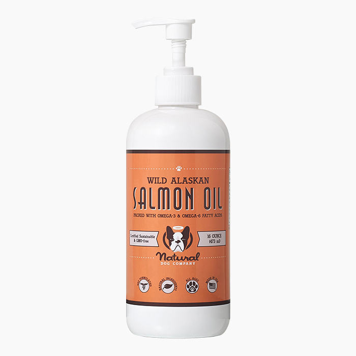 salmon oil with orange label in white bottle