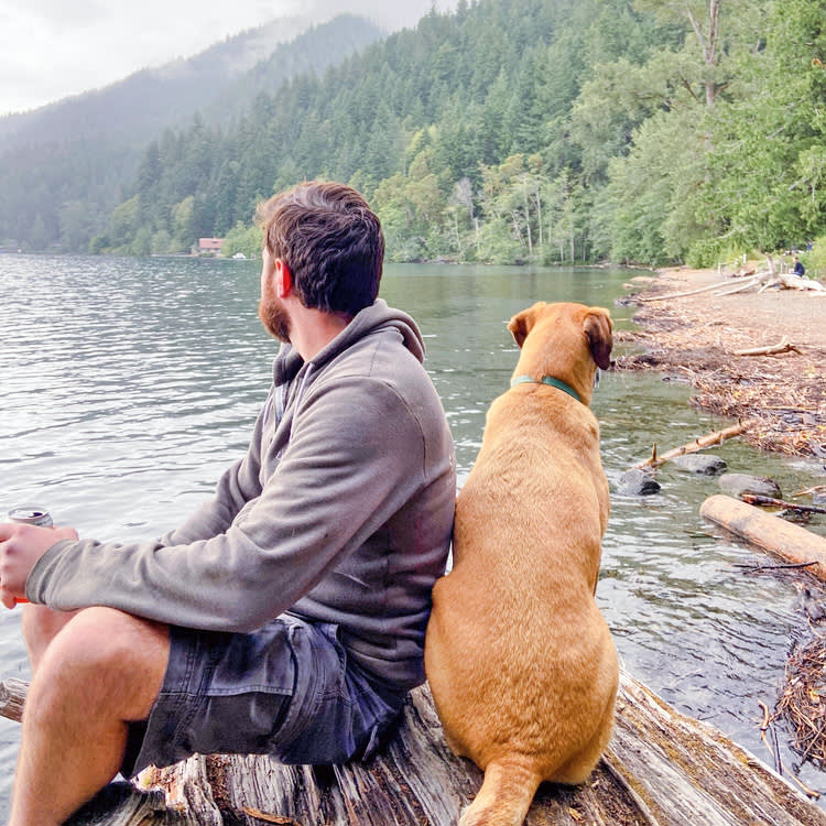 Man at a national park with his dog.