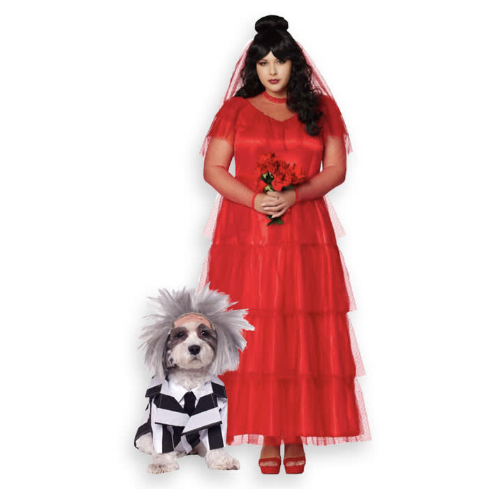 A dog in a Beetlejuice costume, paired with a dog parent dressed as Lydia Deetz