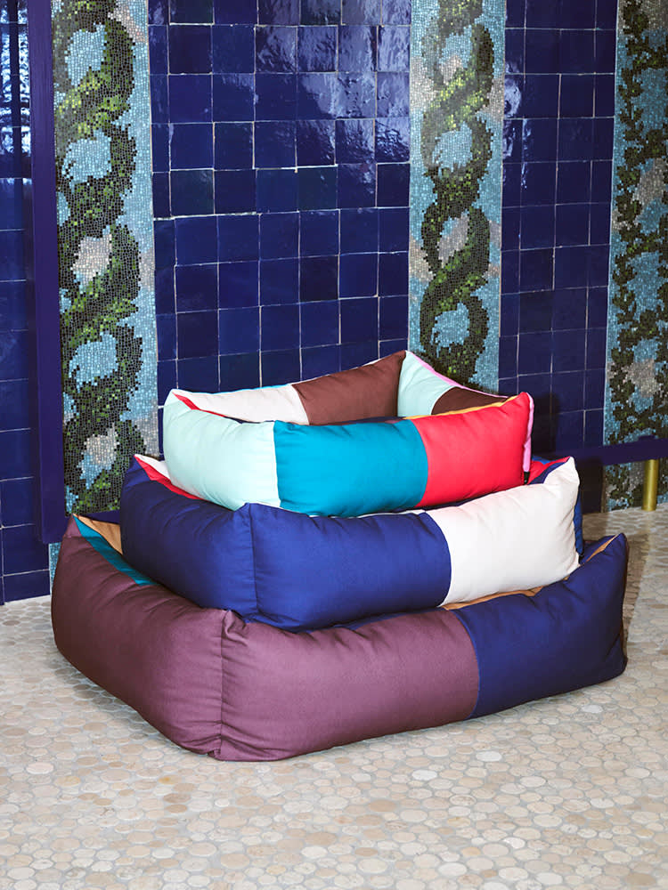 Colourful dog beds from HAY in three different sizes, one on top of each other