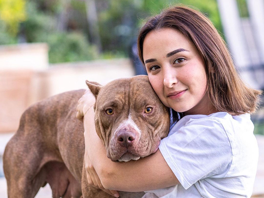Victoria Lily Shaffer and a large dog