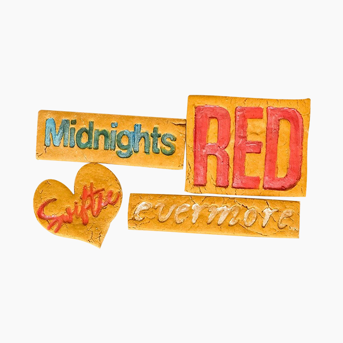 peanut butter dog biscuits with taylor swift song titles on them