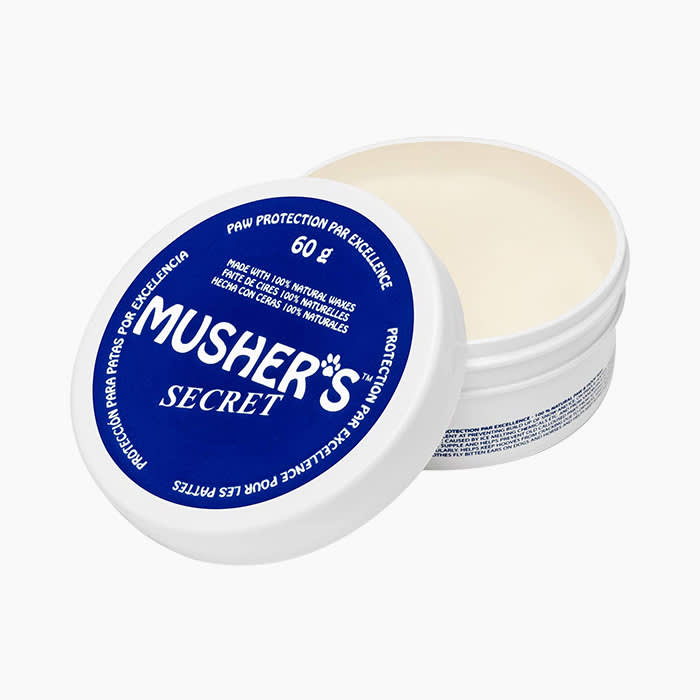 musher's dog paw balm in white tub with blue label