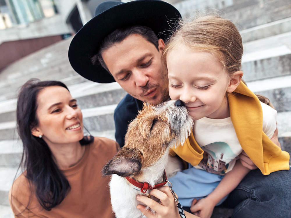 Cute dog family portrait outside.