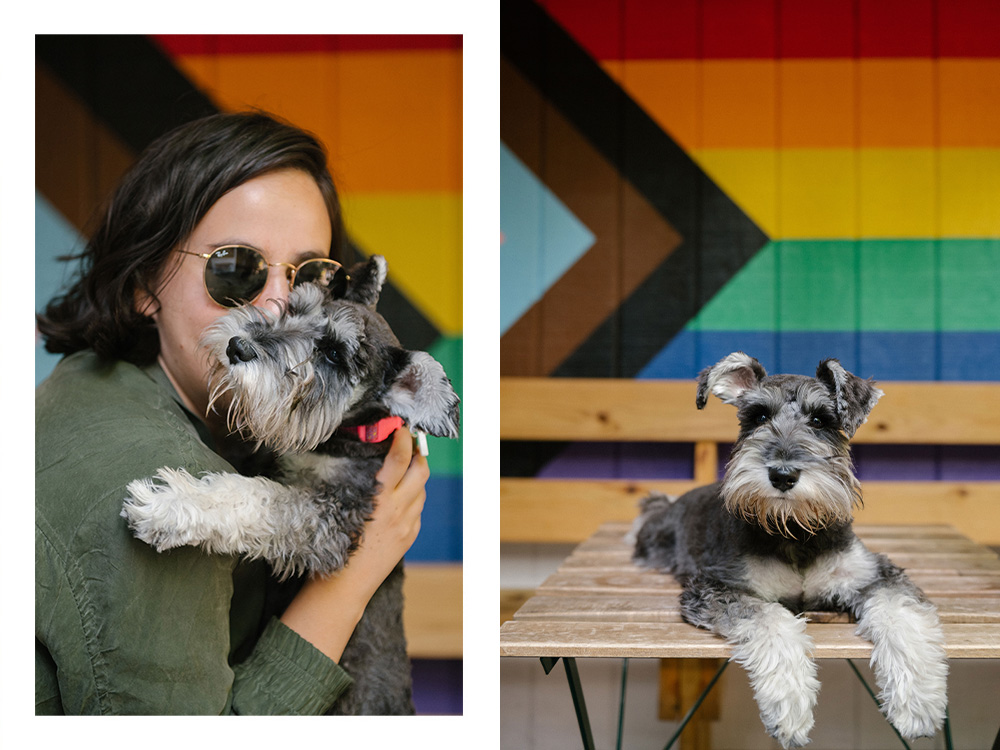 Erica Rose and Patty pose in front of a progress flag at Ginger’s Bar in Brooklyn.