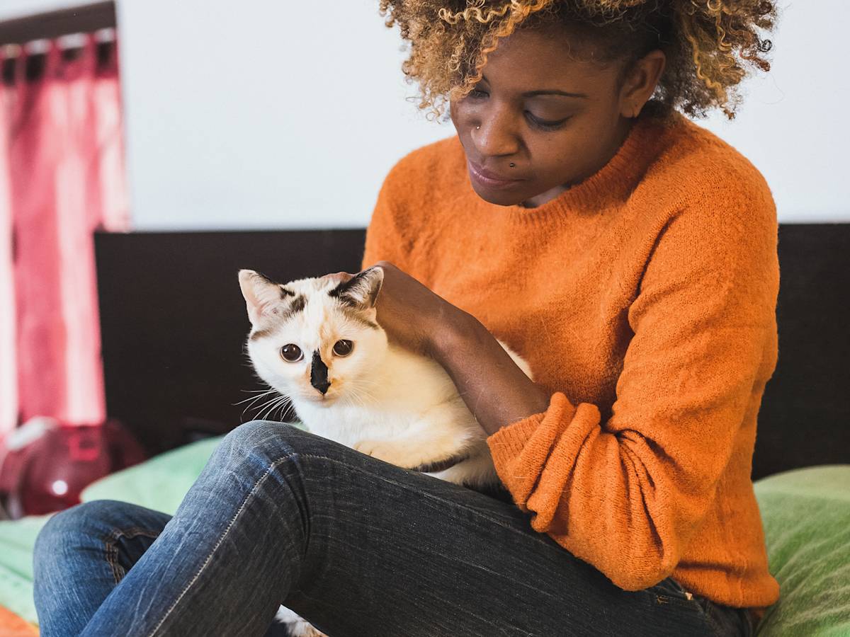 Woman petting her cat