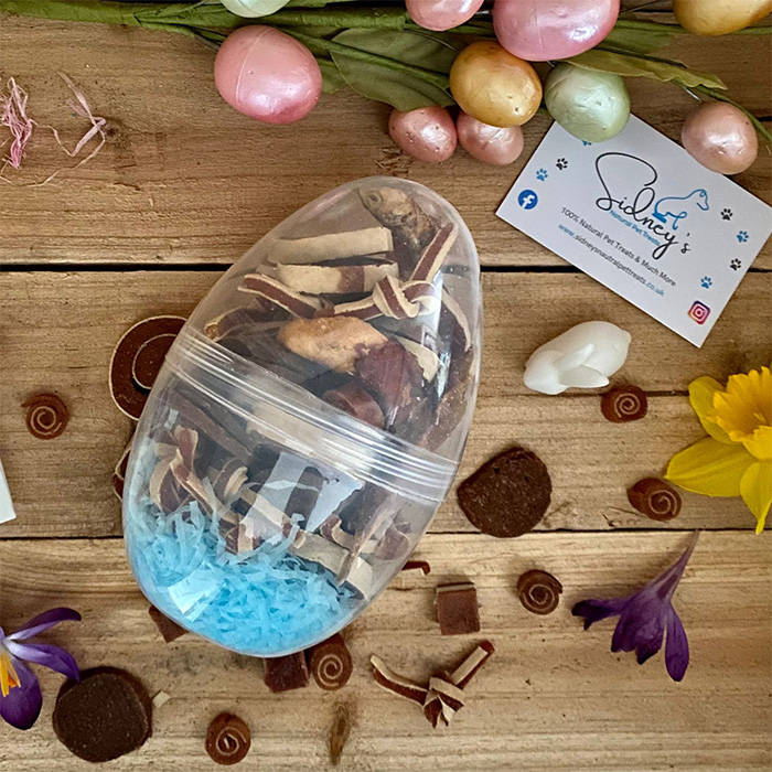 plastic transparent egg filled with dog treats