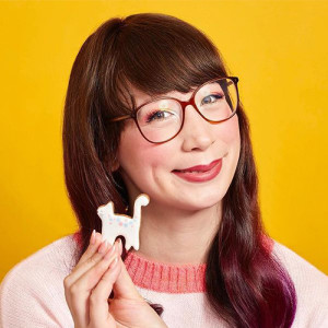 Kim-Joy smiles with a cat-shaped cookie